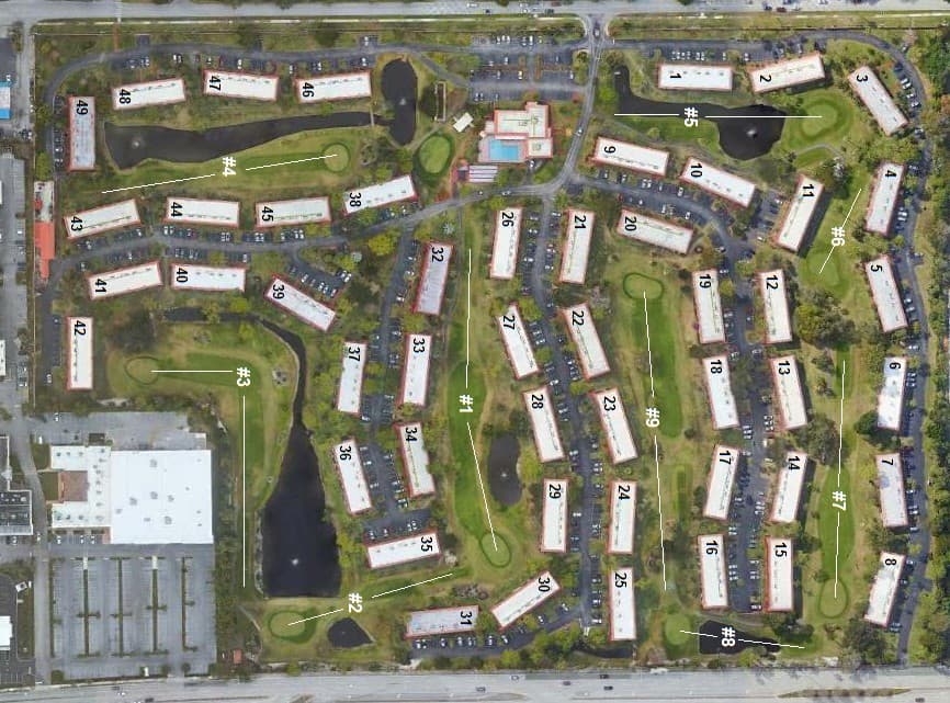 Aerial map of Monterey Yacht & Country Club with golf holes 1 through 9 marked between numbered condominium buildings, the clubhouse and pool, and ponds